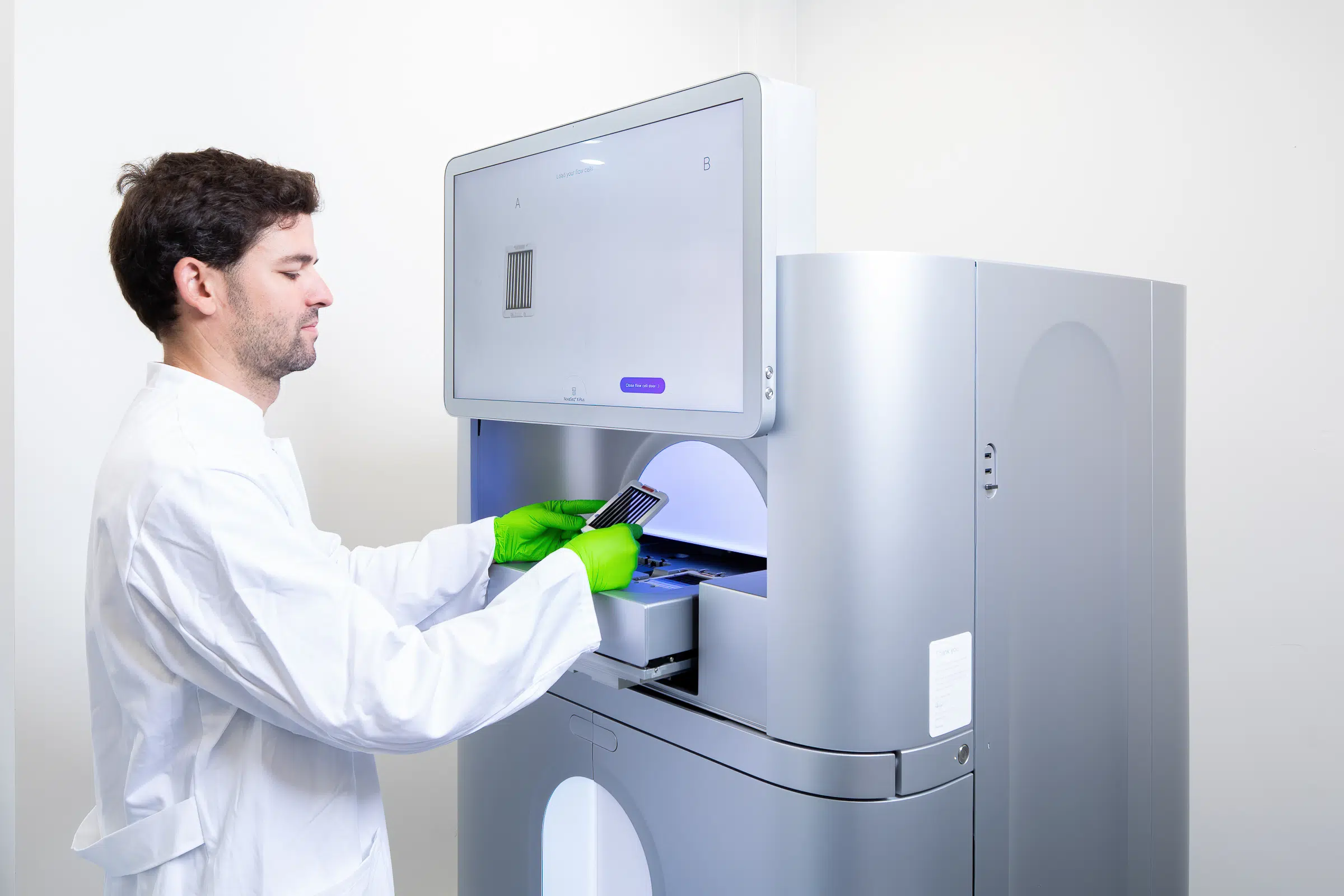 Single cell sequencing Illumina NovaSeq scientist places samples in the new NovaSeq X machine